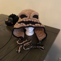 a crocheted hat on top of a mannequin's head