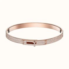 Add some sparkle to your wrist with the Kelly Bracelet, featuring paved diamonds for a touch of luxury. This bracelet will elevate any outfit, making you feel like a true fashionista. Shine bright like a diamond with the Kelly Bracelet. ADDITIONAL INFORMATION Color: Silver, Pink Gold Stone: Cubic Zirconia Ref. od914114 Material:- 925 Sterling Silver - 18k Gold Plated Length:17, 19 Our replica products are committed to quality and color when used. They are made 99% similar to the original. After Kelly Bracelet, Bracelet With Diamonds, Hermes Jewelry, Bracelet Diamond, Iconic Bags, Gold Set, Diamond Bracelets, Pave Diamonds, Pink Gold