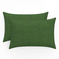 two green pillows sitting next to each other