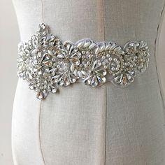 "Rhinestone Applique Diamante Appliques Bridal Sash Belt Glue Iron on Wedding Dress Applique Motif with Beads Crystal Headband Headpiece Size: Width: 3.6\" (9 cm) Length: 11.8\" (30 cm) Perfect for a DIY bridal garter, bridal dress, wedding dress, bridal sash, belts, headpiece, baby headband (as well as many other DIY projects). Stones are all prong set, and sewn into the mesh backing. Application: Heat Press, Sew on, Glue On Price is for one piece, more in stock. We offer special discounts for White Crystal Embellished Sashes, White Crystal Embellished Sash, White Embellished Crystal Sashes, White Embellished Fitted Sash, Beaded Crystal Bridal Belt For Wedding, Crystal Beaded Bridal Belt For Wedding, Fitted Crystal Bridal Belt Embellished, Fitted Crystal Embellished Bridal Belt, Embellished Crystal Bridal Belt