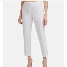 From Tommy Hilfiger, These Pants Feature: Compression Cotton Fabrication Flat Front, Straight Leg Silhouette Elastic At Back Waist Two Slant Front Pockets Two Besom Back Pockets Logo Bar At Wearer's Front Left Pocket Zip Fly With Hook And Hidden Bar Closure Lined Size & Fit Approx. Inseam: 28"; Ankle Length Mid Rise: Approx. 10"; Sits Just Below Natural Waist; Slim Leg Shell 54% Linen, 46% Rayon, Lining- 95% Polyester And 5% Spandex. Dry Clean Note: The Color Is Ivy- Which Is Like Beige. Ankle-length Elastane Dress Pants For Summer, Elegant Cropped Leg Dress Pants For Spring, Summer Ankle-length Elastane Dress Pants, Slim Fit Dress Pants For Spring, Fitted Elastane Dress Pants For Summer, White Elastane Pants For Summer, White Elastane Summer Pants, Cropped Leg Dress Pants For Spring, Elegant White Cropped Leg Pants