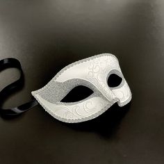 Grandiosity, luxury, and class are only a few adjectives to depict this white mask, and the silver glitter will make you shine. Masquerade Ball Masks For Men, White Masquerade Mask Men, Masquerade Mask Aesthetic Male, Male Masquerade Mask, Masquerade Mask Aesthetic, Masquerade Mask Men, Moon Reference, Masquerade Men, Prom Masquerade