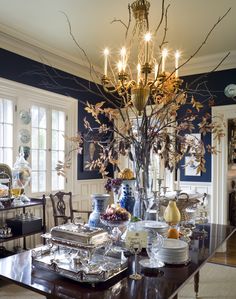 an elegant dining room with chandelier and table