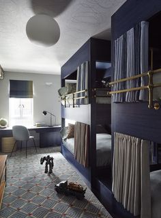 a bunk bed in a bedroom next to a desk