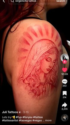 the back of a woman's shoulder with a tattoo design on it and an image of