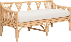 a wooden bench with a white cushion on it