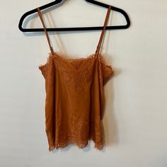 Burnt Orange Lace Tank. Never Worn With Tags, Size Small But Can Fit A Medium Too. Loose Straight Fit Spring Brown Camisole, Brown Spring Camisole, Brown Cami Camisole For Night Out, Brown Cami For Night Out, Brown Camisole For Night Out, Black Lace Tank Top, White Lace Tank Top, Leopard Tank, Floral Cami Top