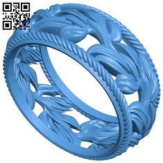 an image of a ring made out of blue plastic with leaves and vines on it