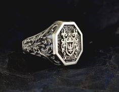 "Your custom solid sterling Silver Ring will be made on your order, customize this Coat of Arms and your logo on this collection! A beautiful symbol that will fit your hands and style. perfect gift for anniversary, special dates and any date you can imagine can be Personalized. Different colors are silver, gold, rose gold. White gold and 24K gold options will never tarnish and last decades. Please contact me if you are interested in my jewelry. >ABOUT ME: I have 35 years of experience in making custom handmade silver and gold jewelry, including custom engraved Signet rings My childhood kind of allowed me to live among precious metals and gems pretty much I opened my workshop back in 1986 Never got bored of making Personalized gifts, birth flower rings, engagement rings with real diamonds F Family Crest Rings, Family Coat Of Arms, Beautiful Symbols, Gift For Anniversary, Signet Rings, Personalized Ring, Personalized Rings, Family Crest, Personalized Products