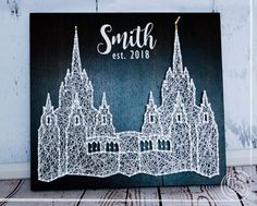 a wooden sign with the name and image of a castle on it that says, smith est