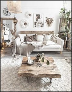 a living room filled with lots of furniture and decor on top of a wooden table