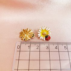 Cute Enamel Daisy Flowers with Ladybugs Studded Earrings, Handmade Earrings Ear Studs, Gift for Her Handmade Enamel Flower Shaped Earrings, Flower Shaped Enamel Jewelry For Pierced Ears, Enamel Clip-on Earrings As Gift, Gift Enamel Flower Earrings, Gold Enamel Flower Earrings For Gift, Gold Daisy Earrings, Studded Earrings, Botanical Earrings, Daisy Studs