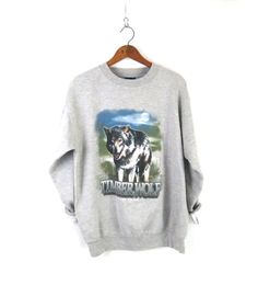 "Timber Wolf vintage pullover sweatshirt in gray M E A S U R E M E N T S - are taken with garments laying flat, across seam to seam ------------------------♥---------- tag: M bust: 22\" (armpit to armpit) | length: 26\" condition: nice vintage  ✩ Every item we sell is pre-loved authentic vintage, ONE-OF-A-KIND, and anywhere from 20 to 60+ years old! You will receive the exact item and size shown in the photos and measurements. Please let us know if you have any questions.✩ ✩ Newly stocked vintag Grunge Gray Sweatshirt For Fall, Fall Grunge Gray Sweatshirt, Winter Grunge Hoodie With Crew Neck, Grunge Graphic Print Sweatshirt For Winter, Grunge Crew Neck Sweater For Winter, Grunge Graphic Print Winter Sweatshirt, Winter Grunge Crew Neck Sweater, Vintage Graphic Print Winter Sweatshirt, Vintage Winter Graphic Print Sweatshirt