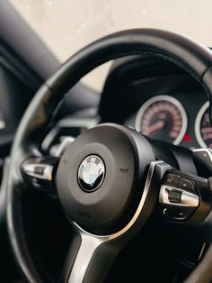 the steering wheel and dashboard of a car