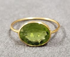 kJewelryaccessories 18k Gold Statement Green Peridot Ring For Women & Girl With Bezel Setting, Big Size Peridot, Gold Jewelry, Birthstone, Oval Shape, Hammered gold, Valentine's Gift, Three Stone Ring, Love & Friendship Ring, Engagement Gold Ring, Pretty Gold Rings, Adjustable Ring, Engagement Ring, Statement Ring, Christmas Gift Products Features :- 1. 18k Gold Peridot Gold Ring 2. Made to Order 3. Gemstone - Peridot 4. Jewelry Type - Gold Ring 5. Total Weight - 1.950 Gram Approx 6. Peridot Wei Luxury Oval Peridot Rings, Oval Peridot Jewelry For Formal Occasions, Formal Oval Peridot Jewelry, Oval Hallmarked Peridot Jewelry, Yellow Gold Polished Peridot Jewelry, Yellow Gold Peridot Jewelry With Polished Finish, Hallmarked Oval Peridot Jewelry, Oval Yellow Gold Peridot Rings, Oval Peridot Ring In Yellow Gold