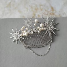 Celestial star hair comb   Great for you or for your bridesmaids . Color: rhodium/silver tone/clear with ivory/cream pearls Measurements: approx 4.5 inches x 2 inches Please NOTE some details/beads can be little bit different as in stock at this moment! Materials: wire,metal findings,clear  rhinestones,ivory/cream faux  pearls, rhodium tone metal comb. Made to order after payment. MORE CELESTIAL: https://www.etsy.com/uk/shop/DonataleAccessories?ref=seller-platform-mcnav&search_query=celestial MATCHING WEDDING JEWELRY: https://www.etsy.com/uk/shop/DonataleAccessories?ref=simple-shop-header-name&listing_id=696986483&search_query=earrings ※ Please note that photos show the example of the design. Due to the nature that each piece is completely hand made - slight variations from the photos are Pearl Hair Comb Wedding, Pearl Bridal Headpiece, Bridesmaid Hair Comb, Bridesmaid Hair Pins, Pearl Hair Vine, Wedding Hair Comb, Fairy Jewelry, Star Hair, Pearl Bridal