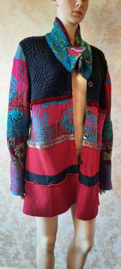 "Vintage multi coloured jacket made of various fabrics.  Five buttons to close, knitted sleeves, middle panel and collar, the black  top section is stretchy and the bottom section is wool. It has velvet ribbons as trimming. Bust;  42\" Length;  33\" Inside arm;  19\"      Made by Oliver Philips" Bohemian Patchwork Sweater Coat For Winter, Bohemian Multicolor Wool Outerwear, Bohemian Winter Cardigan With Buttons, Multicolor Long Sleeve Patchwork Sweater Coat, Bohemian Multicolor Outerwear With Buttons, Multicolor Bohemian Outerwear With Buttons, Knitted Sleeves, Boho Coat, Boho Jacket