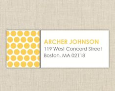 a business card with yellow dots on it