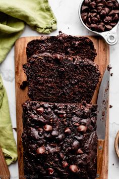 two slices of chocolate banana bread on a cutting board