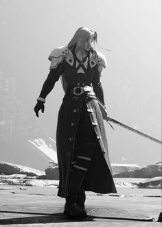 a woman dressed in black and white holding two swords with one hand while standing on the ground