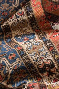 an area rug with many different colors and designs