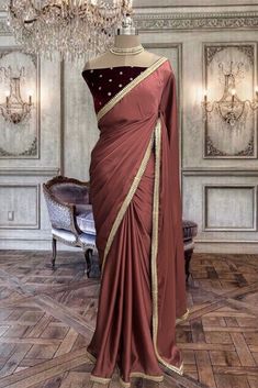 Beautiful light sangria satin georgette saree with unstitched maroon velvet blouse piece. Draped Georgette Saree With Unstitched Blouse, Bollywood Style Draped Georgette Saree, Semi-stitched Draped Saree For Diwali, Diwali Semi-stitched Draped Saree, Georgette Saree With Draped Pallu, Semi-stitched Draped Saree For Eid, Festive Georgette Draped Saree, Festive Draped Georgette Saree, Semi-stitched Draped Silk Saree