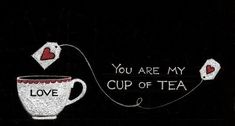 a cup of tea with two hearts on it and the words you are my cup of tea