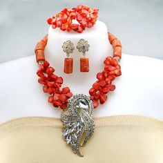 Elevate your bridal look with this stunning wedding necklace Elegant Coral Necklaces For Parties, Red Stone Jewelry For Wedding, Wedding Crystal Jewelry Sets With Stones, Wedding Necklace With Stones, Wedding Necklaces With Stones, Elegant Orange Jewelry With Stones, Red Stone Wedding Necklaces, Beaded Jewelry Sets For Wedding, Luxury Coral Necklace For Formal Occasions