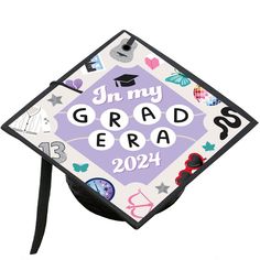 a purple and white graduation cap with the words in my grad era on it