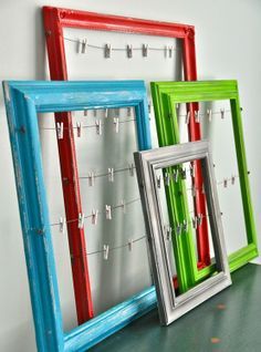 three frames with clothes pins attached to them