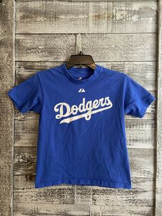 Majestic LA Dodgers Blue T Shirt Penny #31 Boys Size Small 10-11 GUC. Has a few light stains on the back. See pics. Dodgers Tshirt, Dodger Blue, Blue T Shirt, Blue T, Light Stain, Blue Tshirt, Fancy Dresses, Penny, Mens Graphic Tshirt