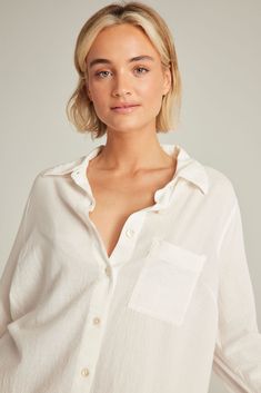 A lightweight organic cotton shirt that's as versatile as it is comfortable.  The perfect staple to take you from bed to beach. A relaxed classic silhouette crafted in organic cotton with mother-of-pearl buttons and a lightweight finish. Pair with The Classic Boxer, The Classic Trouser or simply wear alone.  Crafted with 100% natural materials. Embroidery detail on top back Made from GOTS certified cotton Mother-of-pearl buttons Relaxed fit 100% natural materials Machine Wash Cold.  Hang Dry. Comfortable Relaxed Fit Tops For Vacation, Effortless Summer Loungewear Blouse, Relaxed Cotton Everyday Blouse, Effortless Beach Shirt For Summer, Relaxed Cotton Everyday Shirt, Relaxed Cotton Blouse For Everyday, Relaxed Fit Summer Loungewear Shirt, Effortless Summer Beach Shirt, Relaxed Fit Shirt For Summer Loungewear