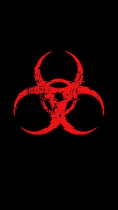 a red biohazard sign on a black background