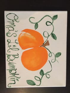 an orange painted on a white card with green leaves and the words happy birthday written in cursive writing