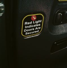 a red light indicates that the doors are secured in place with stickers on them