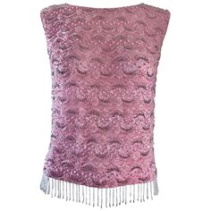 Chic 60s pink silk beaded top! So much detail to this gorgeous little gem! Lace, pearls, sequins and beads throughout. Super soft silk feels amazing against the body! Beaded fringe on the hem. Full metal zipper up the back with hook-and-eye closure. Can easily be dressed up or down. Great with jeans, shorts, trousers or a skirt. In great condition. Made in Hong Kong. Marked Size EU 38 ( Medium / Large ) Measurements: 38 inch bust Up to 36 inch waist Elegant Pink Sleeveless Sequin Fabric, Pink Silk Party Top, Pink Silk Top For Party, Pink Embellished Evening Tops, Elegant Evening Tops With Beaded Fringe, Festive Sleeveless Beaded Top, Festive Beaded Sleeveless Top, Vintage Pink Tops For Party, Vintage Embellished Sleeveless Top