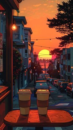 two coffee cups sitting on top of a wooden table in front of a street at sunset