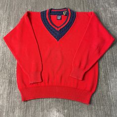 Vintage 2000s Gap Basic Essential Streetwear Causal Preppy Style Y2K Aesthetic Red Pullover V Neck Knit Sweater Extra Large Mens Condition:  Excellent Used Condition  = No Flaws Measurements: Please see photos above for all measurements IF YOU BUY TWO OR MORE ITEMS USE THE CODE BUNDLE @ CHECK TO SAVE 20% WE SHIP WITHIN 24 HOURS AFTER PURCHASE! Please be aware that we do not offer free returns!! The Buyer is responsible for the cost of the return label.  Follow us on TikTok & Instagram @findsnost Y2k V-neck Sweater For Fall, Classic Red V-neck Long Sleeve Sweater, Winter V-neck Sweater For Streetwear, Y2k Style V-neck Sweater For Fall, Y2k V-neck Fall Sweater, Red Knit Tops With Ribbed Cuffs, Casual Red Sweater With Ribbed Cuffs, Red Long Sleeve V-neck Sweater For Winter, Red Ribbed Collar Tops For Streetwear