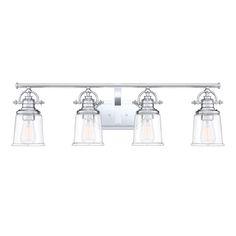 three light bathroom fixture with clear glass shades on the sides and chrome metal fixtures,