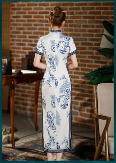 This Qipao/Cheongsam dress has a white base with intricate blue floral and fan patterns, giving it an elegant and timeless look. The hemline falls below the knees, offering a modest yet stylish appearance. The dress is perfect for formal occasions or cultural events, combining traditional elements with modern fashion. Size Guide: Please refer to the size guide picture before placing the order. Please leave your Height, Weight, Bust, Waist and Hip measurements in the Personalisation box so we cou White Fitted Cheongsam With Stand Collar, Traditional White Fitted Cheongsam, Elegant Fitted Cheongsam With Floral Print, Blue Cheongsam, Traditional Fitted Floral Cheongsam, Elegant Floral Print Spring Cheongsam, Qipao Cheongsam, Qipao Dress, Cheongsam Dress