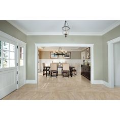 an empty dining room and living room in a house