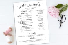 the wedding ceremony program is displayed next to pink carnations and a pair of scissors