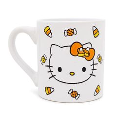 a hello kitty coffee mug with bees and honeycombs on the side, sitting in front of a white background