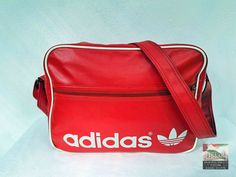 An original vintage Adidas sport bag from the 1980's. An absolute gem for vintage fans. Size:  40 x 30 x15 H x W x D (all dimensions are in cm) Materials: artificial leather, textile, metal condition: The bag is in excellent vintage condition, depending on its age.  The zippers work perfectly. Signs of use. See pictures for details. Shipping: - My shop ships worldwide. - If you like, select the "EXPRESS  shipping" option in the order process to get faster shipping. - You can see the shipping pri Get Faster, Vintage Sport, Sports Bags Gym, Adidas Vintage, Vintage Fans, Sports Gym, Adidas Sport, Team Sports, Sport Gym