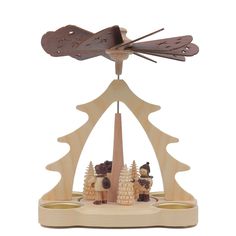 a wooden cuckoo clock with two people on it's roof and an arrow above the top