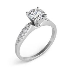 a white gold engagement ring with diamonds on the side