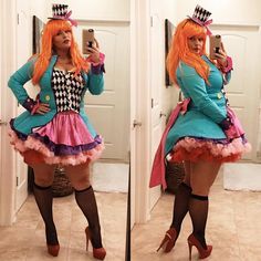 a woman in a costume taking a selfie