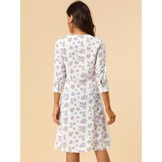 With its pretty floral print, the dress is an elegant and feminine option. With a classic fit and flare shape, the below-the-knee length dress is perfect for summer occasions. This pretty summer dress has a flattering fit-and-flare silhouette. Featuring an all-over floral print, the dress has inverted pleats detailing throughout, V-neckline, and short sleeves. Vintage-inspired and tailored to fit-and-flare silhouette, it features short sleeves, a button front, and a v-neckline for a pretty aesth Feminine Knee-length Mini Dress With Ditsy Floral Print, Feminine Knee-length Ditsy Floral Mini Dress, Feminine Ditsy Floral Knee-length Dress, Mid-length Floral Print Dress For Daywear, Mid-length Floral Dress For Daywear, Daywear Dresses With Floral Print And 3/4 Sleeves, Floral Print Knee-length Mini Dress For Daywear, A-line Ditsy Floral Print Dress, Knee-length Ditsy Floral Print Dress For Daywear