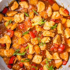 a white bowl filled with chicken and vegetables