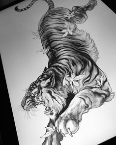 a black and white drawing of a tiger with flowers on it's back legs